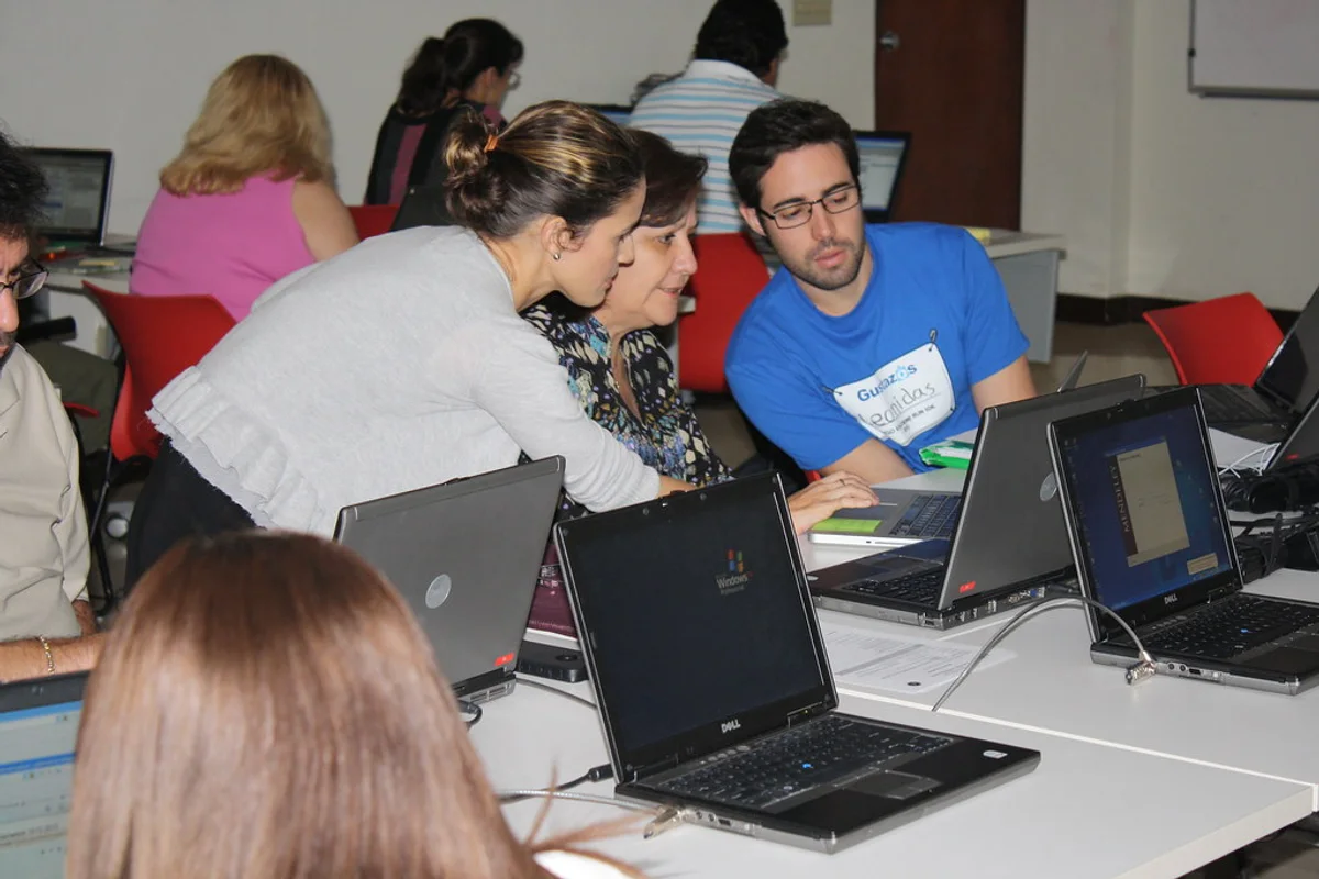 Training provider staff reviewing learner evidence for How do attendance records support accreditation?