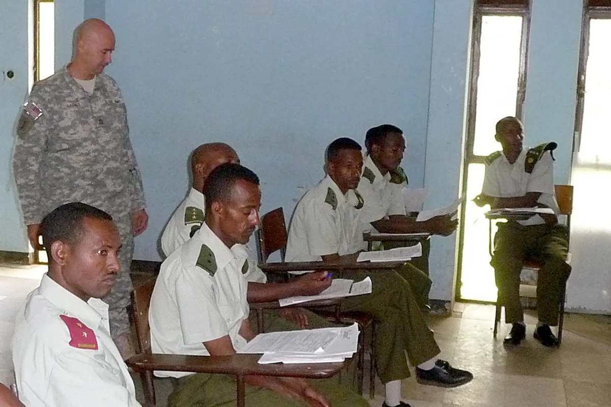 Training provider staff reviewing learner evidence for How do I connect accreditation, learner records, certificates, and verification?