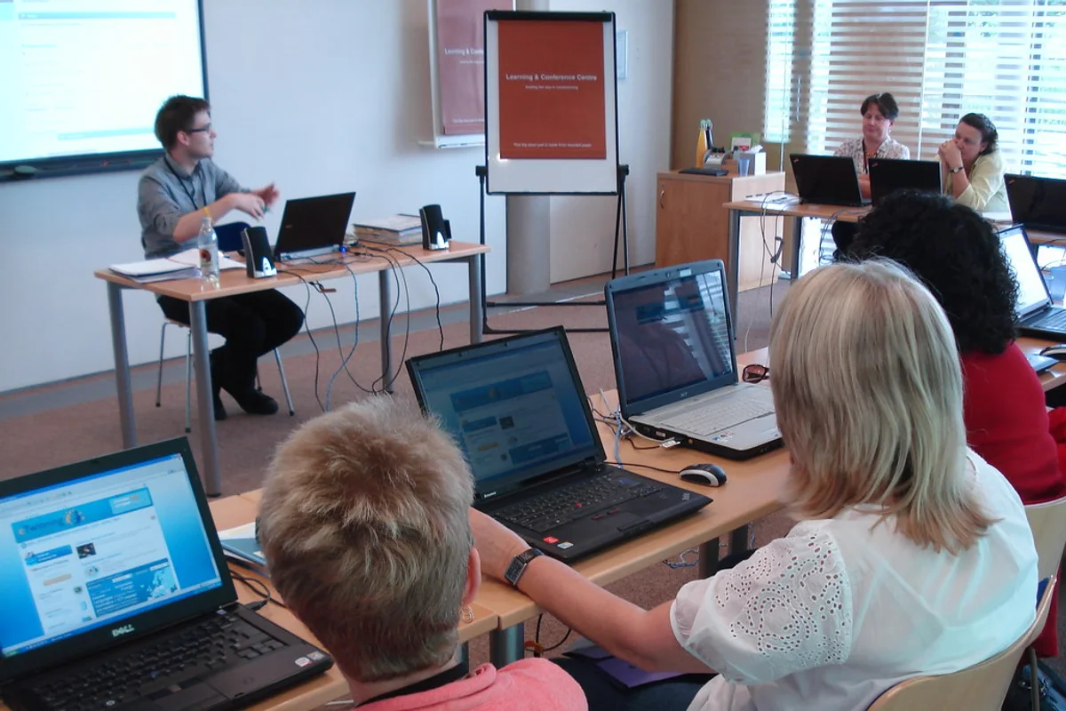Quality manager organising digital accreditation evidence for How do I create an accreditation dashboard for management?