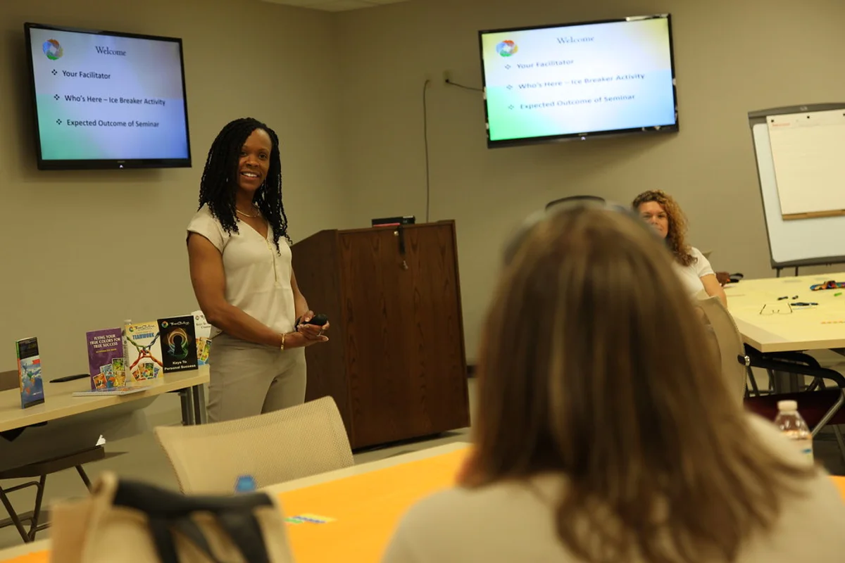Training provider staff reviewing learner evidence for How do I manage accreditation evidence when learners are spread across multiple workplaces?