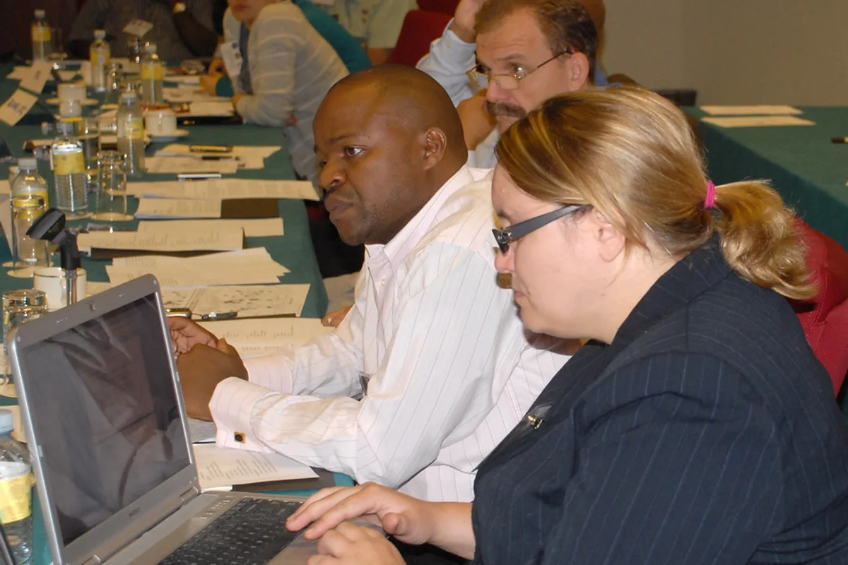 Training provider team reviewing accreditation evidence for How do I prove that my facilitators are qualified enough for accreditation?