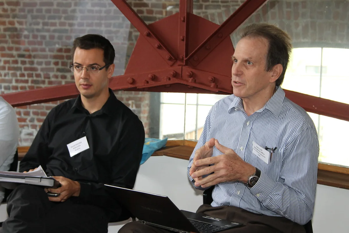 Facilitator and supervisor reviewing workplace evidence for How do I prove that workplace mentors or supervisors are involved properly?